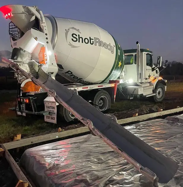 Concrete mixer truck discharging on-site